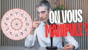 Moi pointant du doigt une roue d’horoscope avec les signes du zodiaque, avec le texte “on vous manipule”.